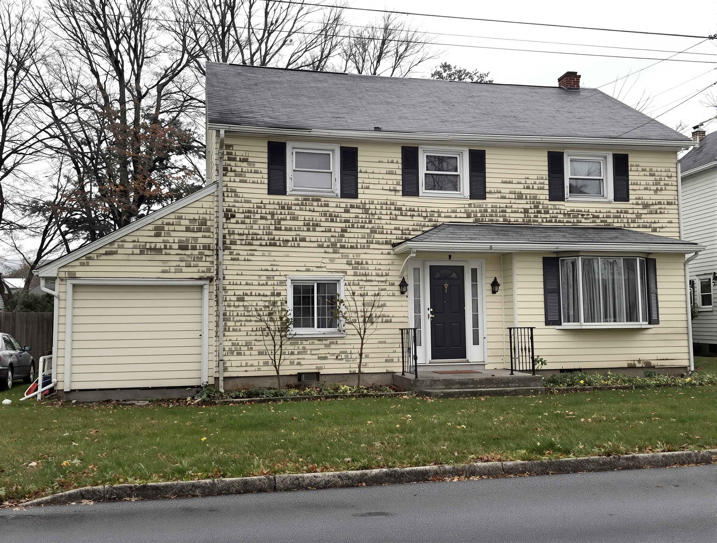 Faded vinyl colonial in Massapequa before residing