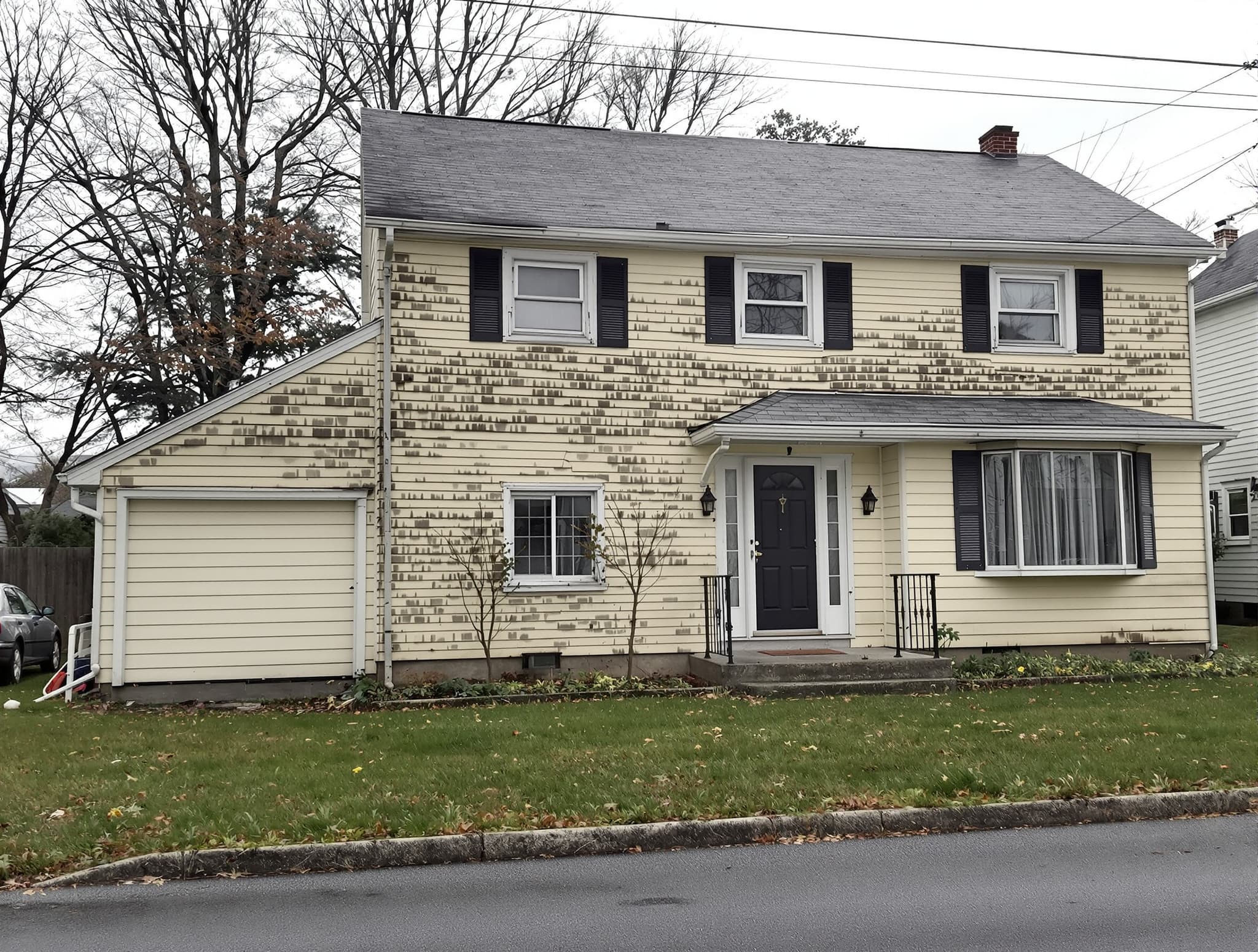 Faded vinyl colonial in Massapequa before residing