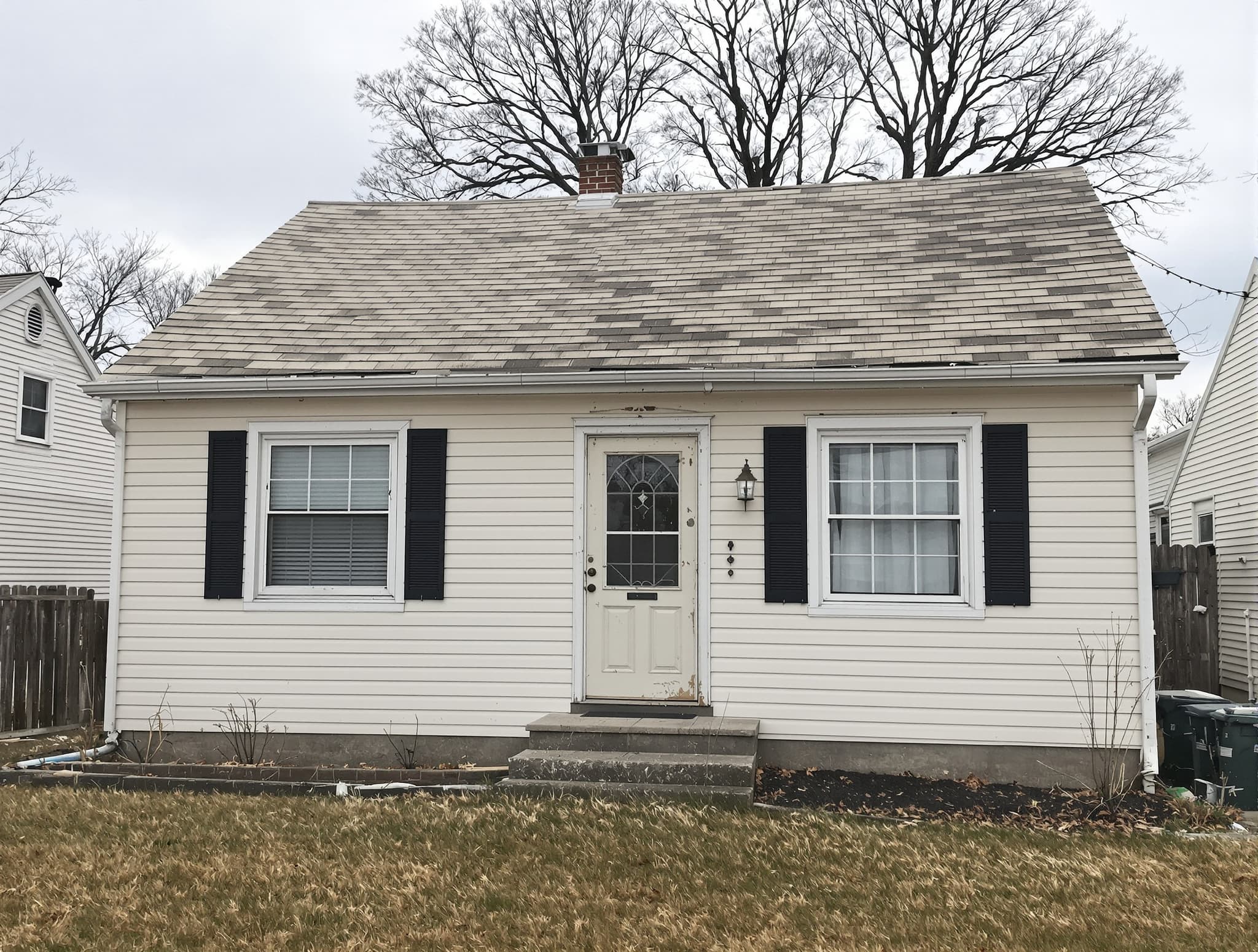 Post-war Levittown cape with original asbestos shingles